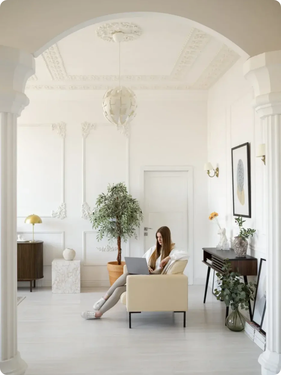Homepage hero photo: a bright Prague apartment with an arched doorway