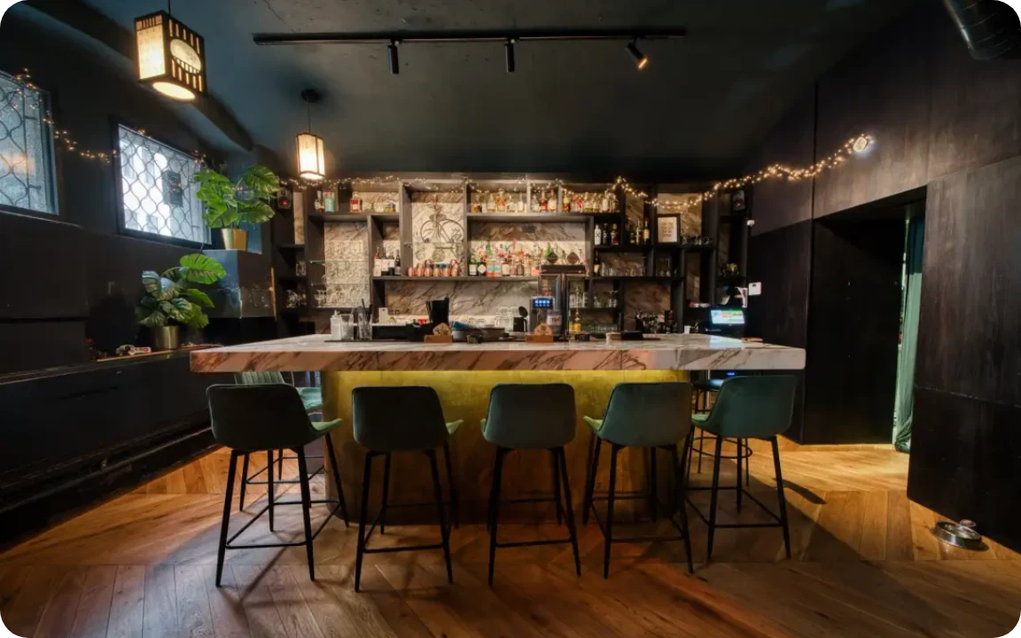 The bar counter with green stools